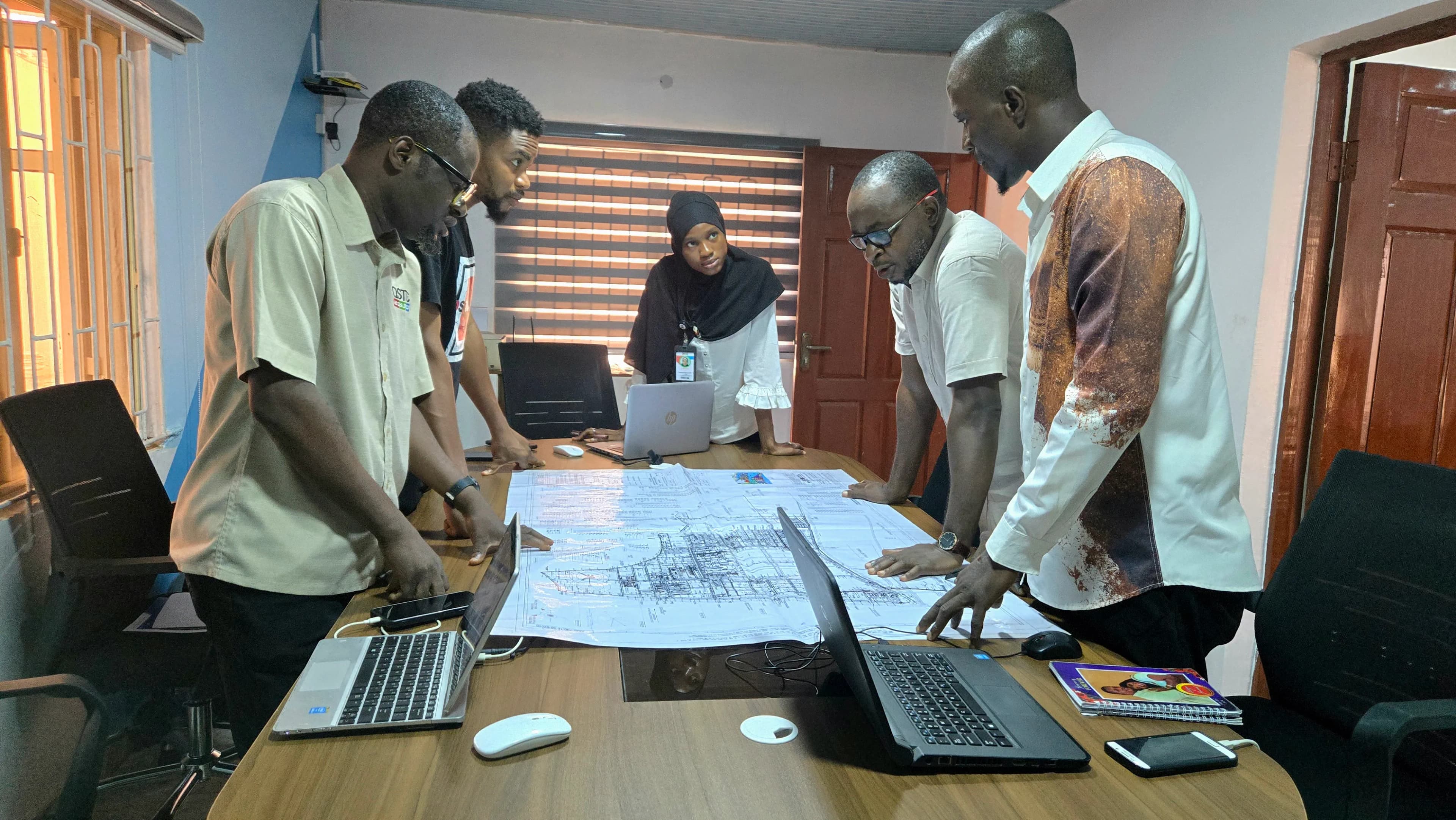 Engineers discussing project in a modern office